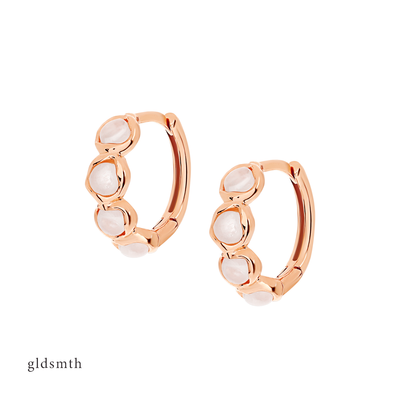 Elegant and fine earrings. Handcrafted solid rose gold huggies set with moonstones.
