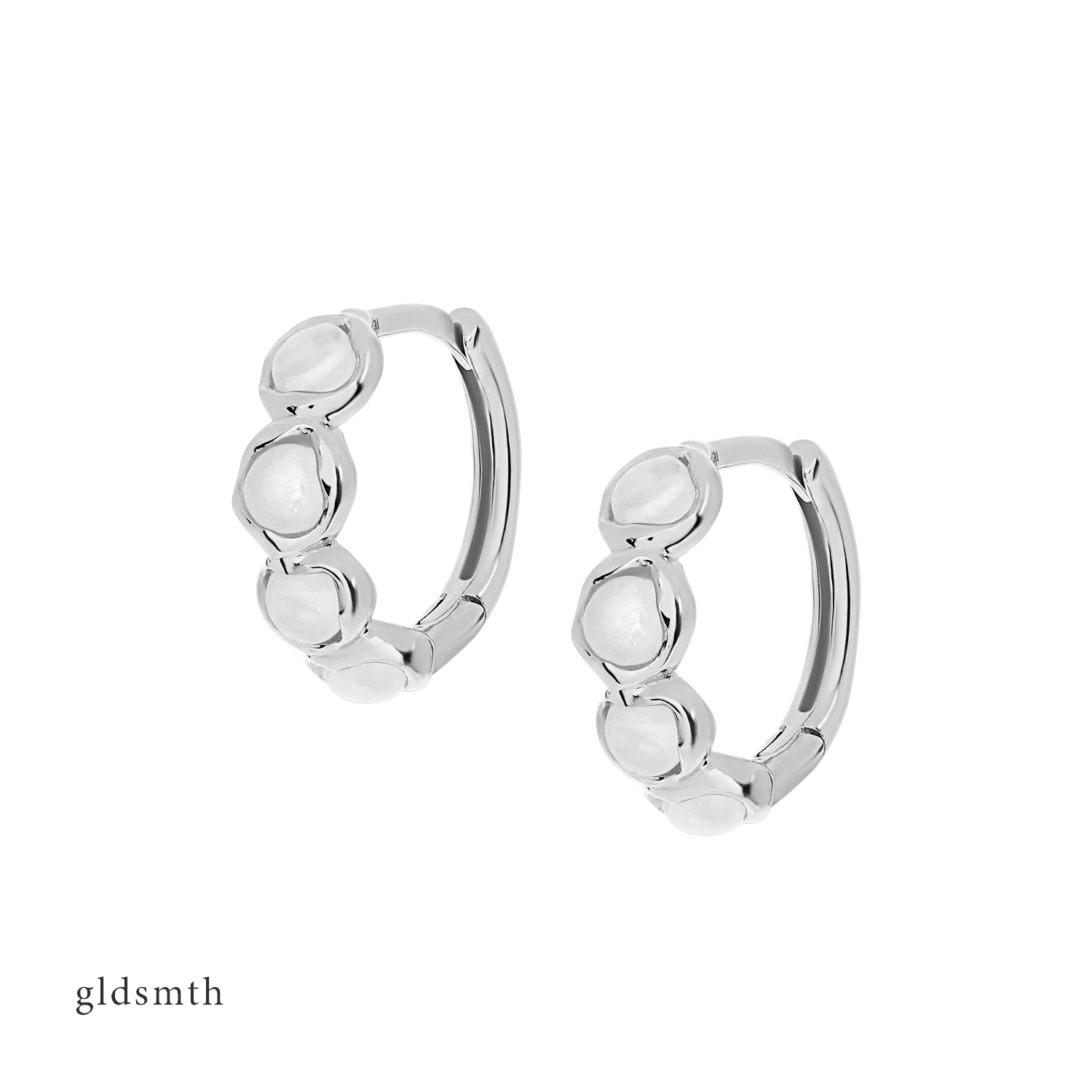 Elegant and fine earrings. Handcrafted solid white gold huggies set with moonstones.
